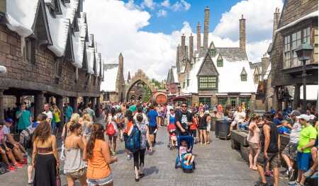 Visitors sample the Harry Potter–themed attractions and shops at Hogsmeade Village inside the Universal Studios Islands of Adventure theme park in Orlando.