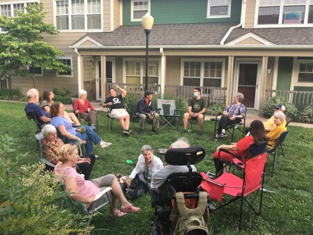 Neighbors catch up at Viernes Social, a weekly summer gathering at Takoma Village in Washington, D.C.