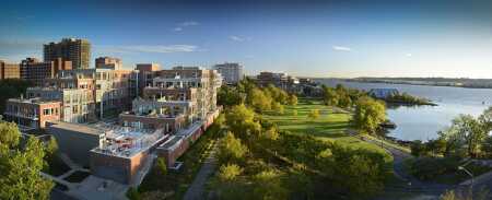 The former offices of the Sheet Metal Workers International Association in Alexandria, Virginia, are today a fully sold, 60-unit luxury condominium named the Oronoco. The EYA-developed project retains much of the original building structure and offers extensive amenities and river views. (EYA Photography by Thomas Arledge)