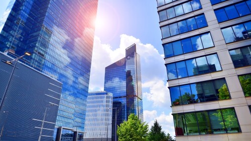 Glass,Facade,Of,The,Buildings,With,A,Blue,Sky.,Skyscrapers