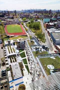 Buildings and rooftops offer expansive views of permanent open space to the south  of the site. Green roofs provide outdoor space for recreation and gardening. (David Sundberg) 