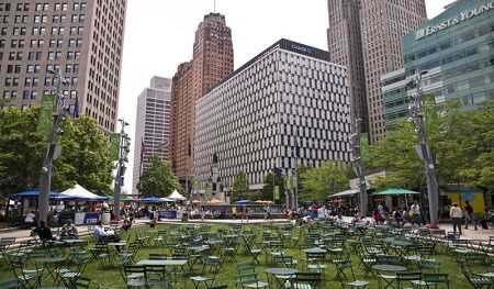 Local businessman Dan Gilbert bought dozens of vacant and underused commercial properties in downtown Detroit to set up his family of companies. Quicken Loans occupies several floors of the Qube, shown at center, formerly known as the Chase Tower.
