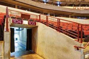 A more powerful solution to improve cellphone reception is called a distributed antenna system, or DAS. It can improve phone service over a larger expanse of space, inside or outside. A DAS was installed at Chicago’s United Center arena, and one of the system’s antennas is embedded in the box atop the exit sign. (Connectivity Wireless)