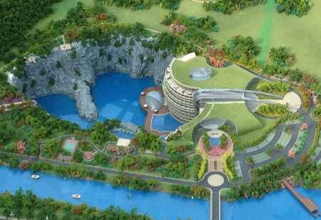 A hotel and resort complex is being built in a repurposed quarry near Shanghai. Part of the structure will sit below water, affording a view of an aquarium. (Martin Jochman, JADE+QA)