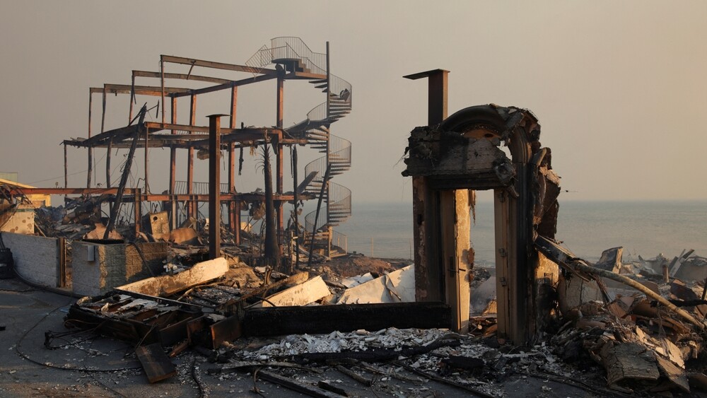 Charred,Structures,Remain,In,Ruin,As,Powerful,Winds,Fan,The