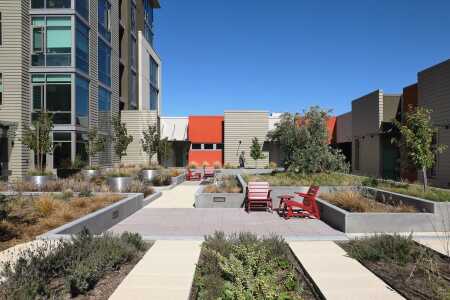 One of the innovative water management strategies in California is water reuse. San Francisco’s new 38 Dolores multifamily project, designed by BAR Architects, includes a landscaped terrace with raised planter beds of native, drought-resistant plants. Water that hits this level flows through beddings and is captured by a subsurface drainage system and reused for irrigating the overall site. (BAR Architects) 