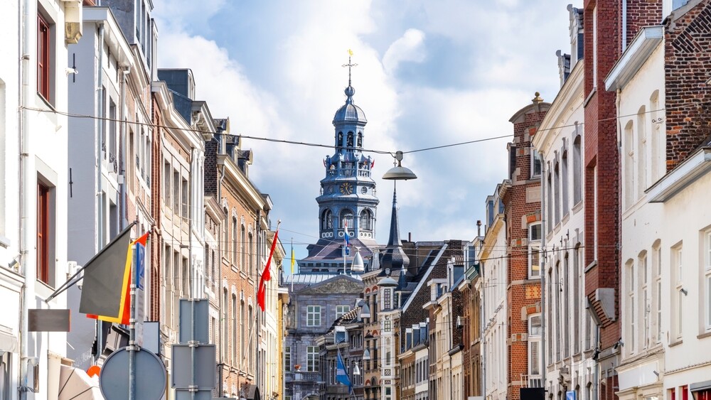 Maastricht,,Netherlands.,Beautiful,Facades,With,Town,Hall,In,Background