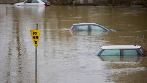 Abandoned,Cars,Submerged,In,Flood,Water,In,Parking,Lot,In