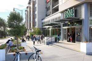 Situated on a oddly shaped 0.72-acre (0.29 ha) parcel, the Prado Group’s 38 Dolores development in San Francisco includes an eight-story mixed-use building with 81 luxury rental condominiums above a 30,000-square-foot (2,800 sq m) Whole Foods Market. Working with BAR Architects, the Prado Group transformed an underused urban site into a high-density mixed-use project. Certified LEED Gold, the project incorporates high-quality high-rise construction with environmentally sensitive materials. (©Doug Dun/BAR Architects)