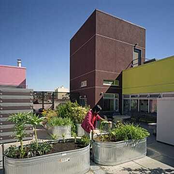 The garden plots at Curran House in San Francisco’s Tenderloin neighborhood are visible from the rooftop laundry room. (©brian rose)