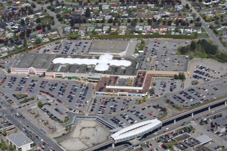 Vancouver commercial real estate:  An aerial image of the low-density Brentwood Town Centre. Below: Plans call for the addition of 11 residential towers.