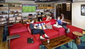 ©Sean Karns/Perkins Eastman. The ninth-floor living room provides common space with an entertainment center for residents.