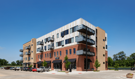 Eagle View Partners has developed the second new mixed-use building, MU1, for downtown Cedar Falls, Iowa, as part of the River Place Development. The first building was completed in 2015. Designed by Slingshot Architecture, the second building includes 30 residential units and 20,000 square feet (1,900 sq m) of retail, restaurant, and office space. Slingshot is now working on a mixed-use building to the north centered on a large gathering plaza that binds the development together. (SLINGSHOT ARCHITECTURE)