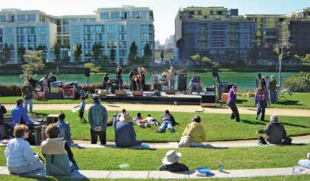 A concert in the park at the restored Mission Creek waterfront in San Francisco, part of more than $700 million in public infrastructure financed through special assessments and TIF for the Mission Bay redevelopment project. (San Francisco Office of Community Investment and Infrastructure)