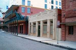 In downtown San Antonio, an area of largely abandoned buildings was redeveloped as the Sunset Station area of restaurants, hotels, and offices. One of the buildings repaired was the storefront which received masonry repairs, new paint, and a new awning, and now houses an engineering company. (San Antonio City Design Center)