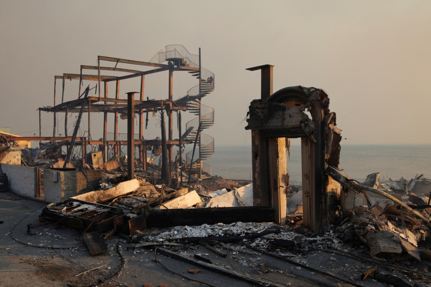 Charred,Structures,Remain,In,Ruin,As,Powerful,Winds,Fan,The