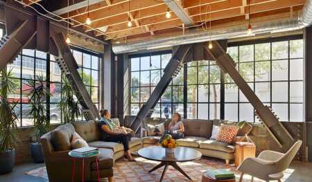 ©Bruce Damonte. At the San Francisco headquarters of Thumbtack, Boor Bridges designed distinct lounge areas for each floor with living room–style furniture.