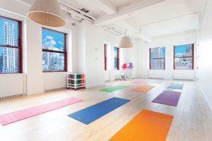 Shutterstock’s offices offer a yoga studio for employees. According to a government study, the company’s office design reduces its energy consumption by a verified 22.9 percent. (© Empire State Realty Trust Inc.)