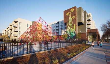 The city’s promenade and playground view, with Station Center’s custom mural toward the right.