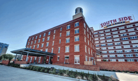 Dallas-based Matthews Southwest launched the redevelopment of southern Dallas’s Cedars neighborhood 20 years ago with South Side on Lamar, the adaptive reuse of an historic Sears warehouse-office complex into 455 residential lofts, 25 artist studios, and 120,000 square feet (11,100 sq m) of office and retail space located one block from the Cedars light-rail station. Above, NYLO Dallas South Side Hotel, a century-old casket factory converted into a luxury urban-loft boutique hotel. (Matthews Southwest)