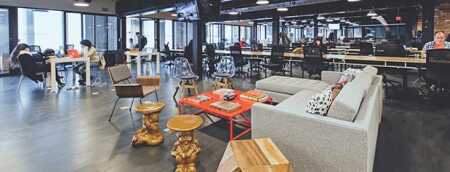 WeWork’s interior design features playful flourishes, such as gnome tables, that appeal to the ironic sensibilities of millennial workers. (Photo Courtesy of WeWork)