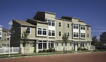 Each two-family unit includes two separate entrances—one for owners and the other for tenants. This attached structure includes four two-family units, with eight entrances. (Arverne by the Sea LLC)