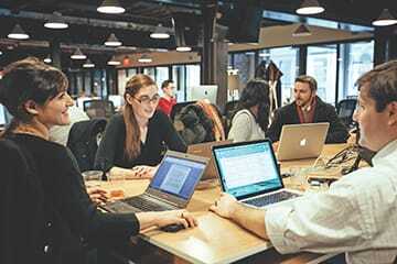One of the appeals of coworking is interaction with peers who work in other businesses. (Photo Courtesy of WeWork)
