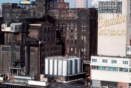 Mayor Bill de Blasio struck a deal with Domino Sugar plant site developer Jed Walentas to add 50,000 square feet (4,600 sq m) of affordable housing to the planned $1.5 billion office, retail, and residential complex. The additional 40 affordable units, allowing more two- and three-bedroom apartments, will bring the total to 700 affordable units among the 2,300 total housing units planned at the site. (© Paul Martinka/Splash News/Corbis)