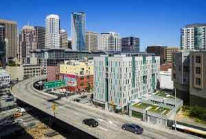 The Rene Cazenave Apartments development, which occupies the site of a freeway off-ramp demolished after the Loma Prieta earthquake, includes a private landscaped courtyard for residents. The first project completed in the Transbay Redevelopment Area, the development contains 120 apartments for formerly homeless individuals, supportive services, and ground-floor retail space. (©Tim Griffith)