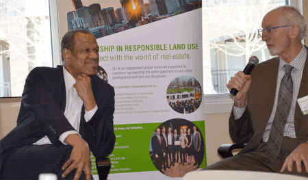 Egbert Perry left, chairman and CEO of the Integral Group, and Michael Leccese, ULI Colorado executive director, speaking at an event in Denver.